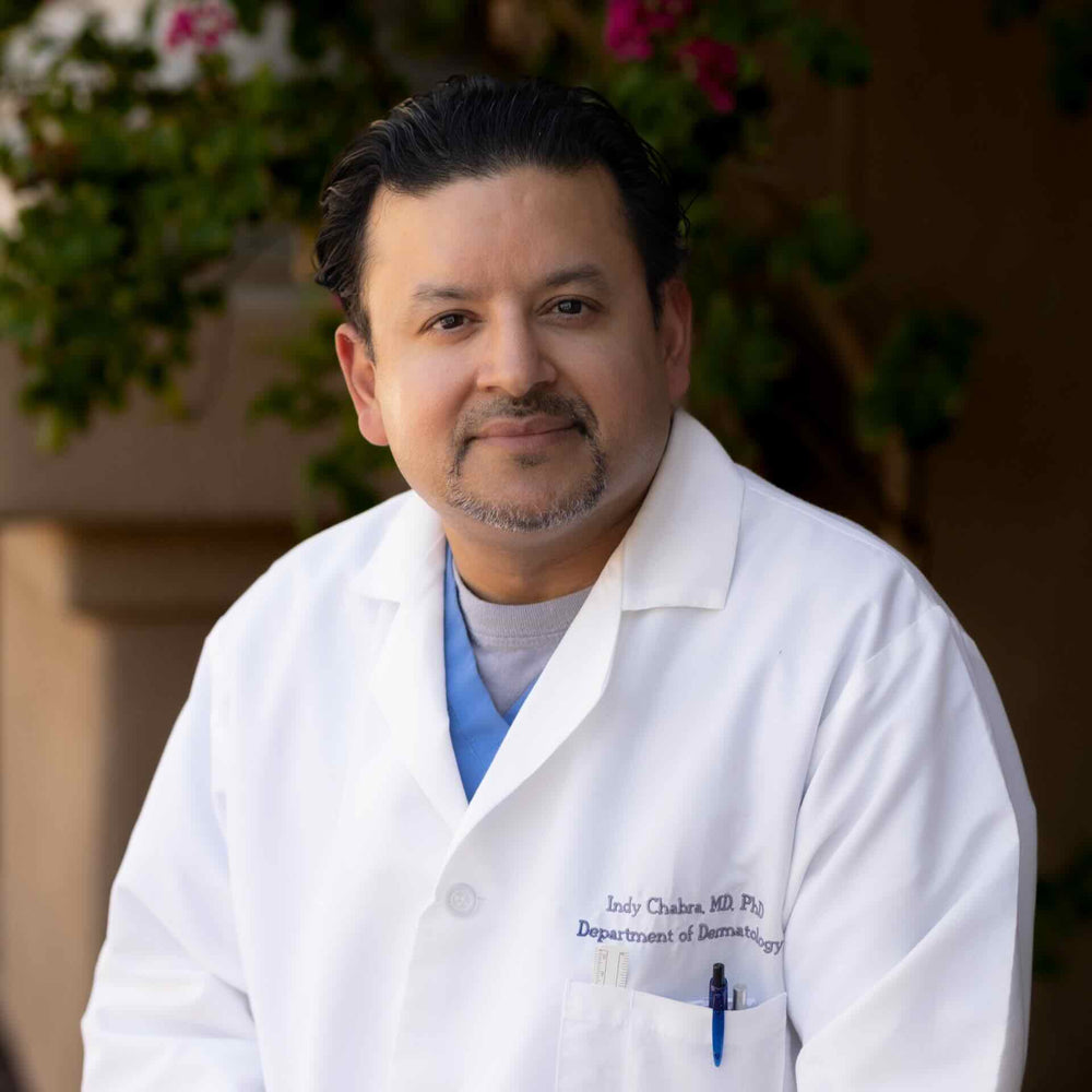 Dermatologist in white labcoat researching science backed skincare ingredients