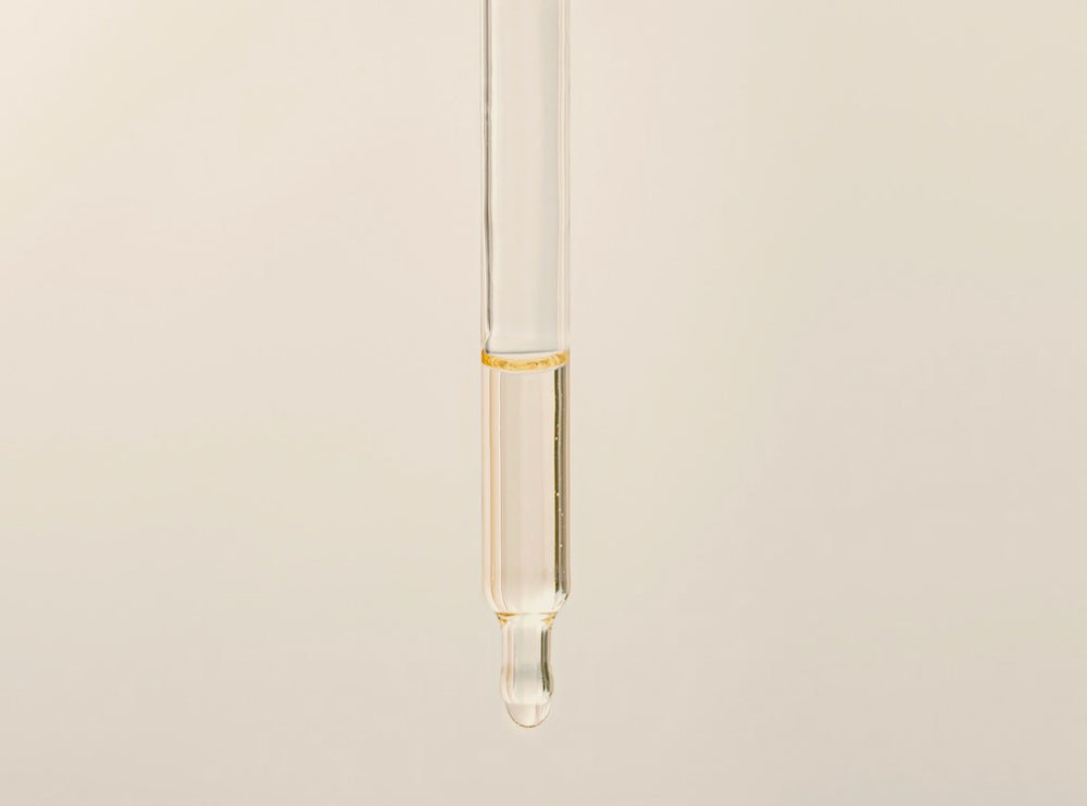  Scientific and clean skincare product shown in a dropper 
