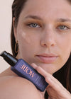  woman with healthy skin using glow serum with vitamin c and antioxidant ingredients 